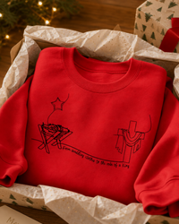 Load image into Gallery viewer, Swaddling Clothes to a King's Robe | Unisex Premium Sweatshirt (Black Print)